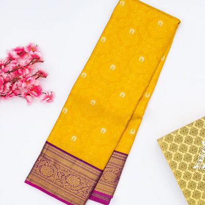 Yellow Handloom Kanchipuram Korvai Silk Saree With Floral Motifs & Contrast Magenta Border