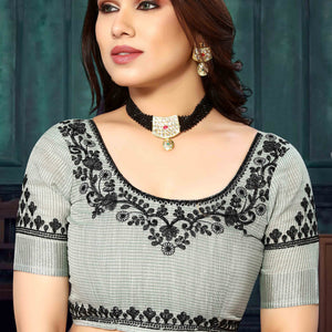 green-embroidered-linen-cotton-saree-with-zari-border
