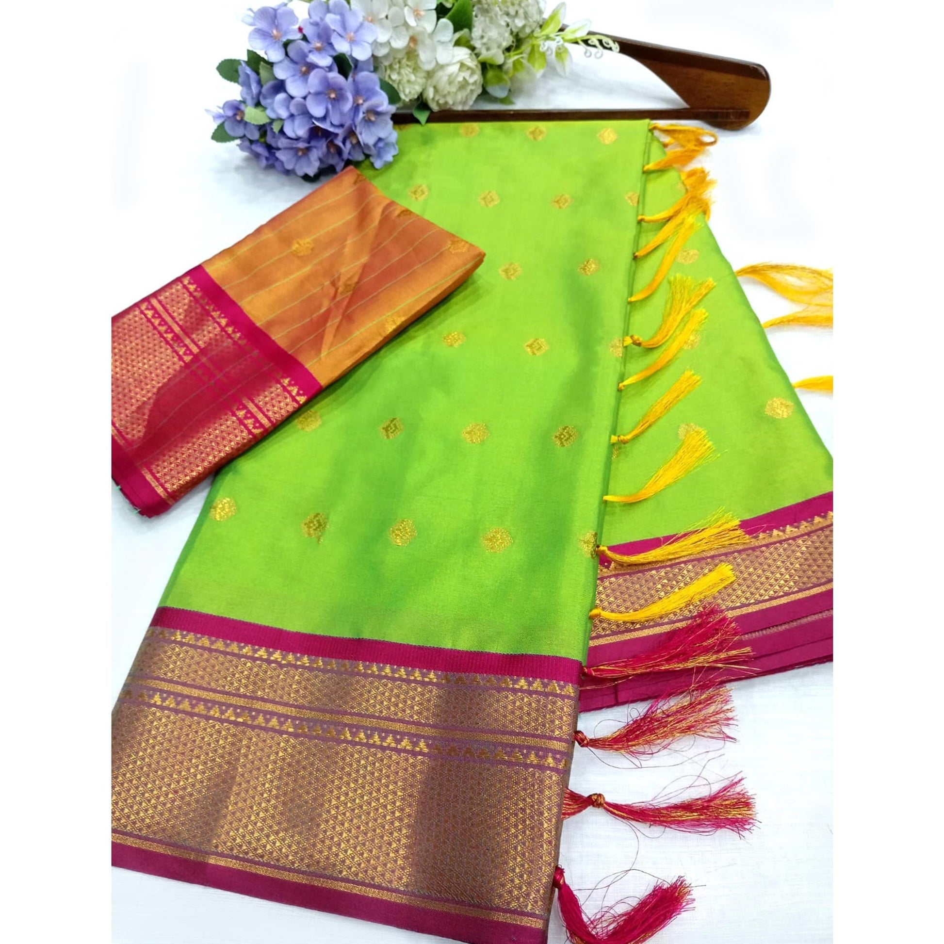 green-zari-woven-lichi-art-silk-saree-with-tassels