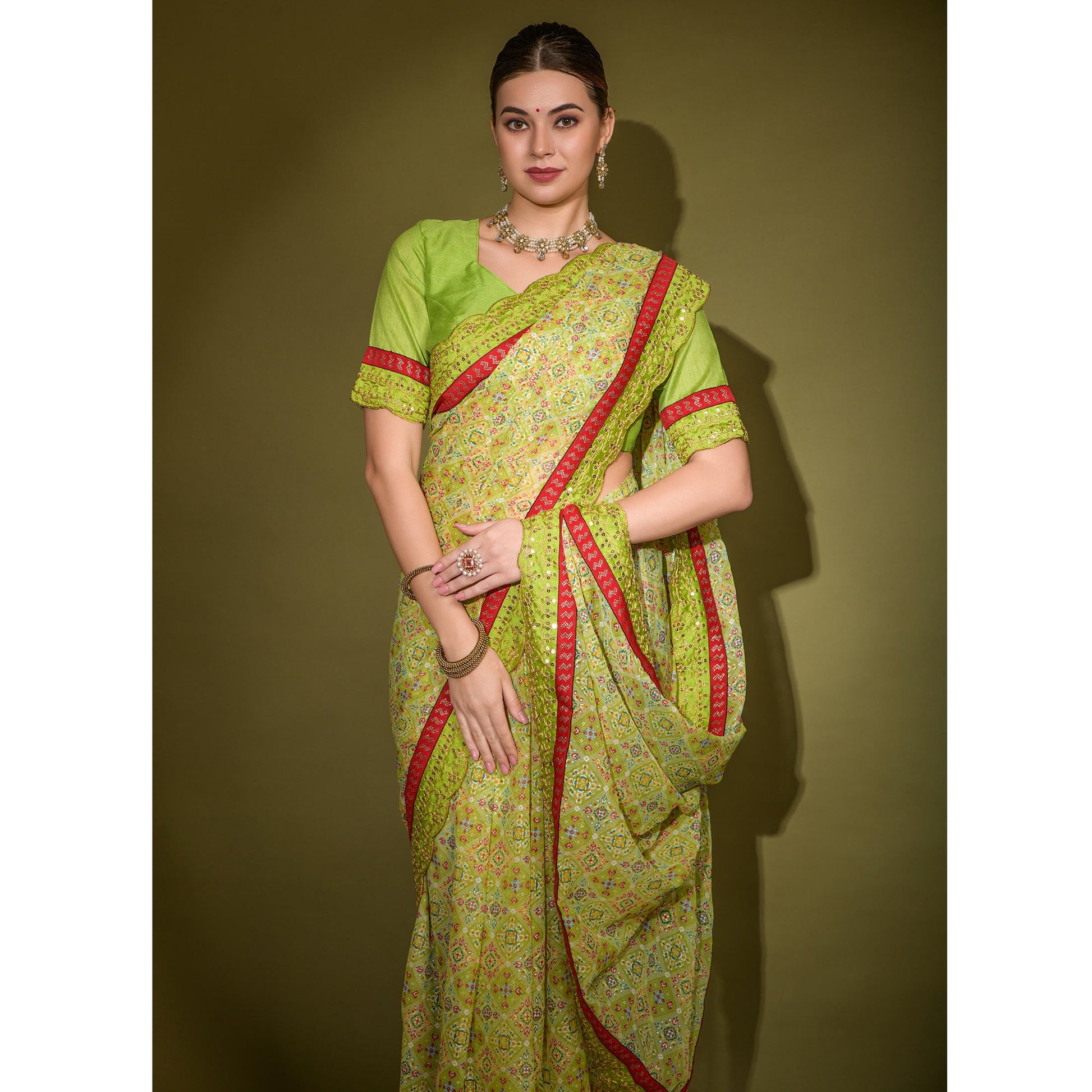 green-patola-foil-printed-georgette-saree-with-embroidered-border