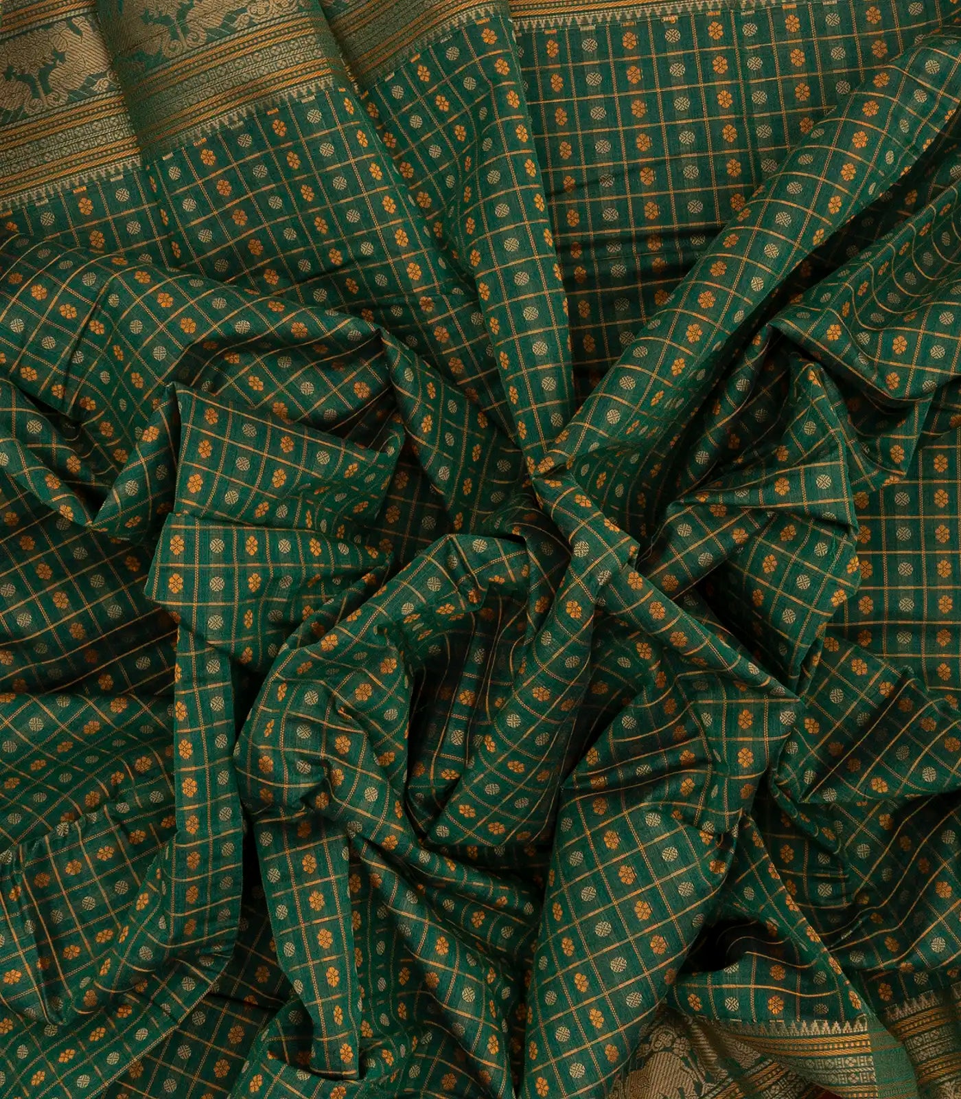 Dark Green Handloom Kanchi Cotton Saree With Checks & Chakaram Motifs.