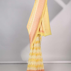 Yellow zig-zag striped banaras georgette saree with contrast border & geometric design pallu