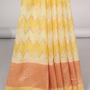 Yellow zig-zag striped banaras georgette saree with contrast border & geometric design pallu