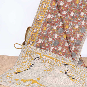 Brown village-theme machine-printed kalamkari cotton saree,  contrast Pichwai cow border & human figurines pallu