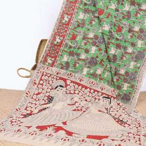 Green village-theme machine-printed kalamkari cotton saree,  contrast Pichwai cow border & human figurines pallu