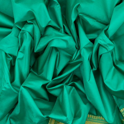 Aquamarine woven Plain Banarasi Silk Saree With Floral Motifs In Border