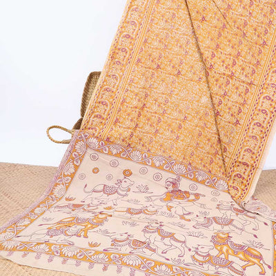 Orange intricately machine-printed kalamkari cotton saree, contrast Pichwai cow & God Krishna motif pallu
