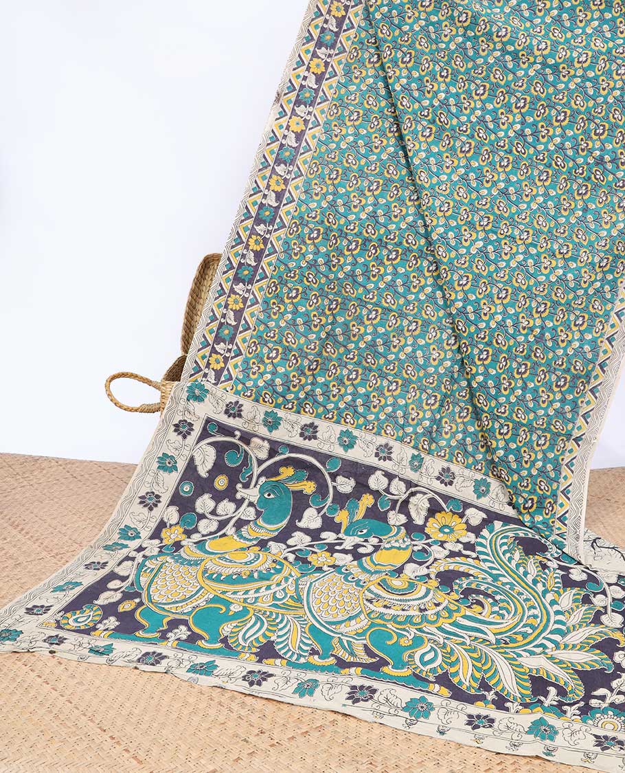Blue floral machine-printed kalamkari cotton saree, floral & chevron border & peacock pallu