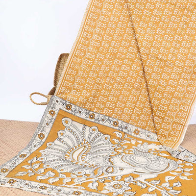 Orange batik machine-printed kalamkari cotton saree, self-border & peacock pallu