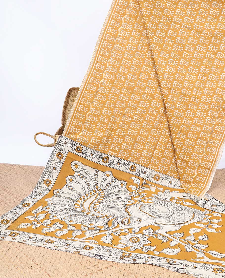 Orange batik machine-printed kalamkari cotton saree, self-border & peacock pallu