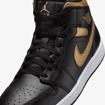 JORDAN | AIR JORDAN 1 MID { BLACK/METALLIC GOLD-WHITE
