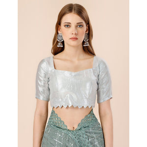 green-tikki-wor-lycra-saree-with-embroidered-border