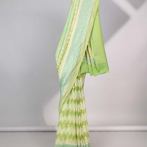 Green zig-zag striped banaras georgette saree with contrast border & geometric design pallu