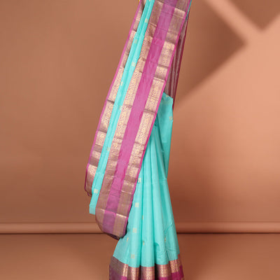 Blue geometric buttas silk saree with contrast rettai pettu brorder of traditional designs & intricate zari design pallu