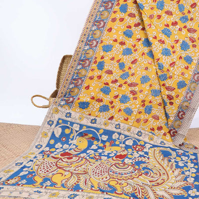 Yellow floral vine machine-printed kalamkari cotton saree, contrast tree motifs border & peacock pallu