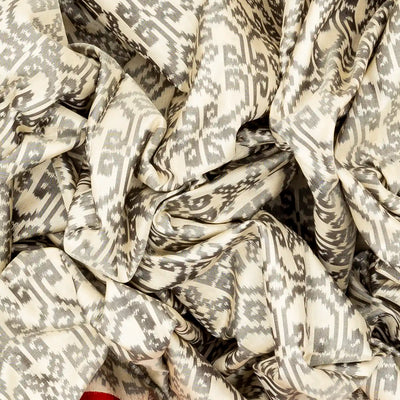 White Handloom Ikat Silk Saree With Contrast Red Border