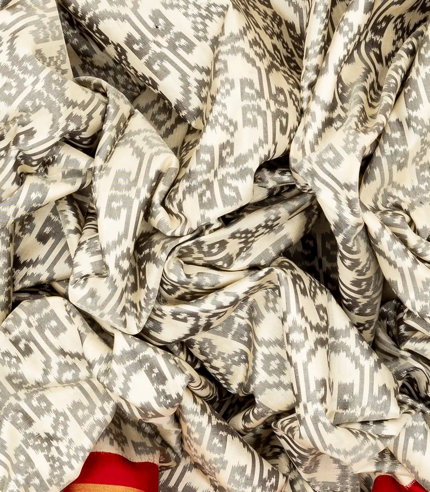 White Handloom Ikat Silk Saree With Contrast Red Border