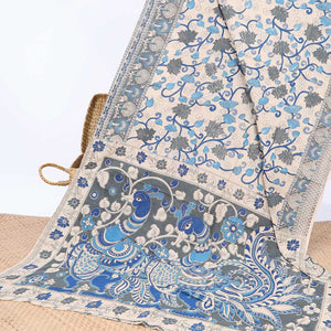 Cream floral vine machine-printed kalamkari cotton saree, contrast tree motifs border & peacock pallu
