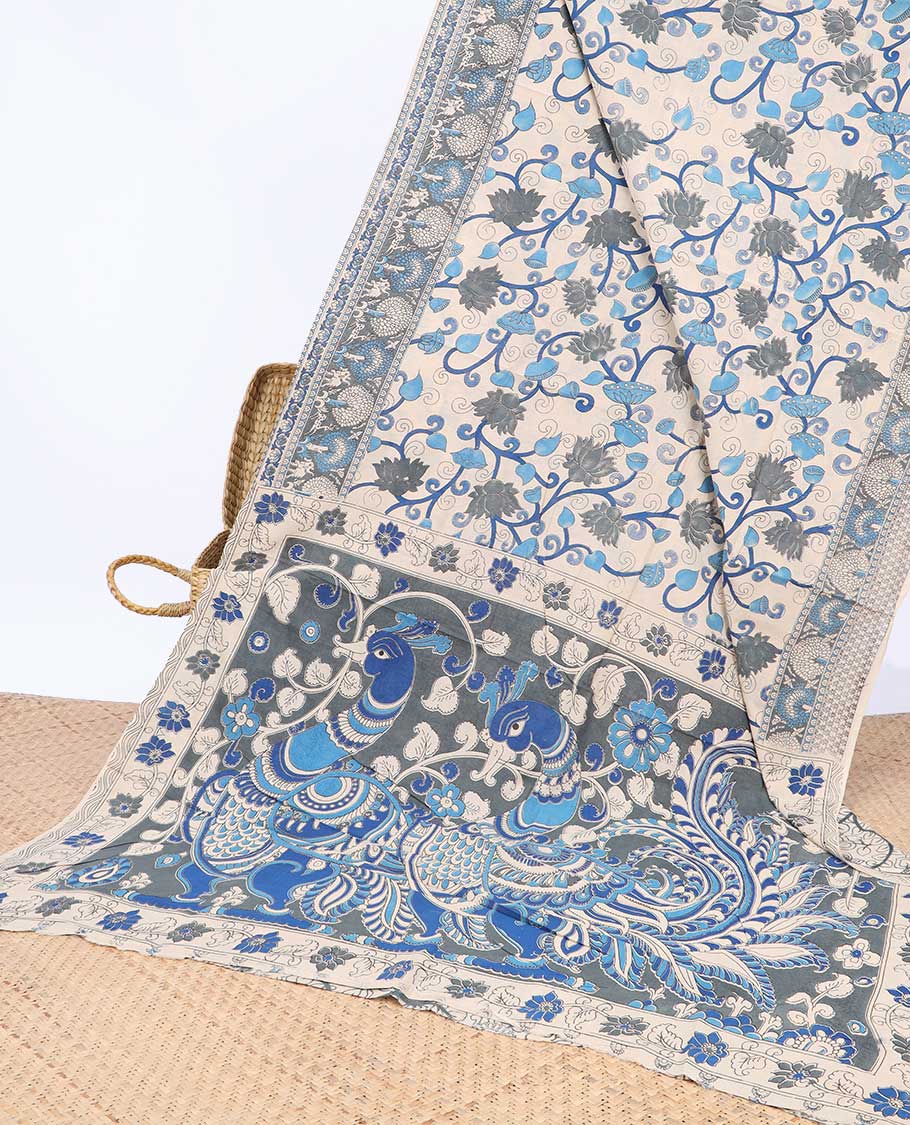 Cream floral vine machine-printed kalamkari cotton saree, contrast tree motifs border & peacock pallu