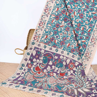Blue floral machine-printed kalamkari cotton saree, contrast floral border & peacock pallu