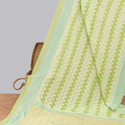 Green zig-zag striped banaras georgette saree with contrast border & geometric design pallu