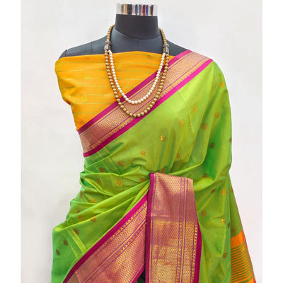 green-zari-woven-lichi-art-silk-saree-with-tassels