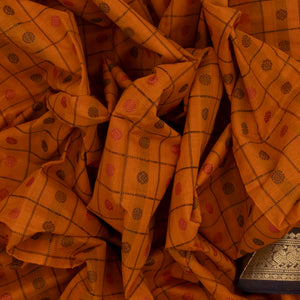 Mustard Handloom Kanchi Cotton Saree With Checks & Chakaram Motifs.