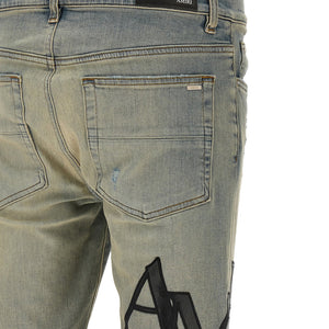 Amiri Staggered Logo Jeans
