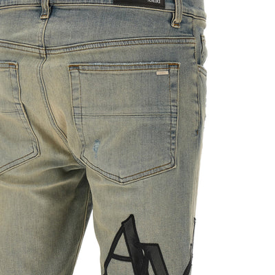 Amiri Staggered Logo Jeans