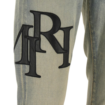 Amiri Staggered Logo Jeans