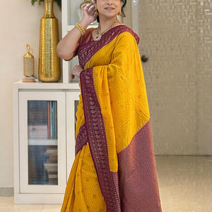 Adorning Yellow Soft Silk Saree With Unique Blouse Piece