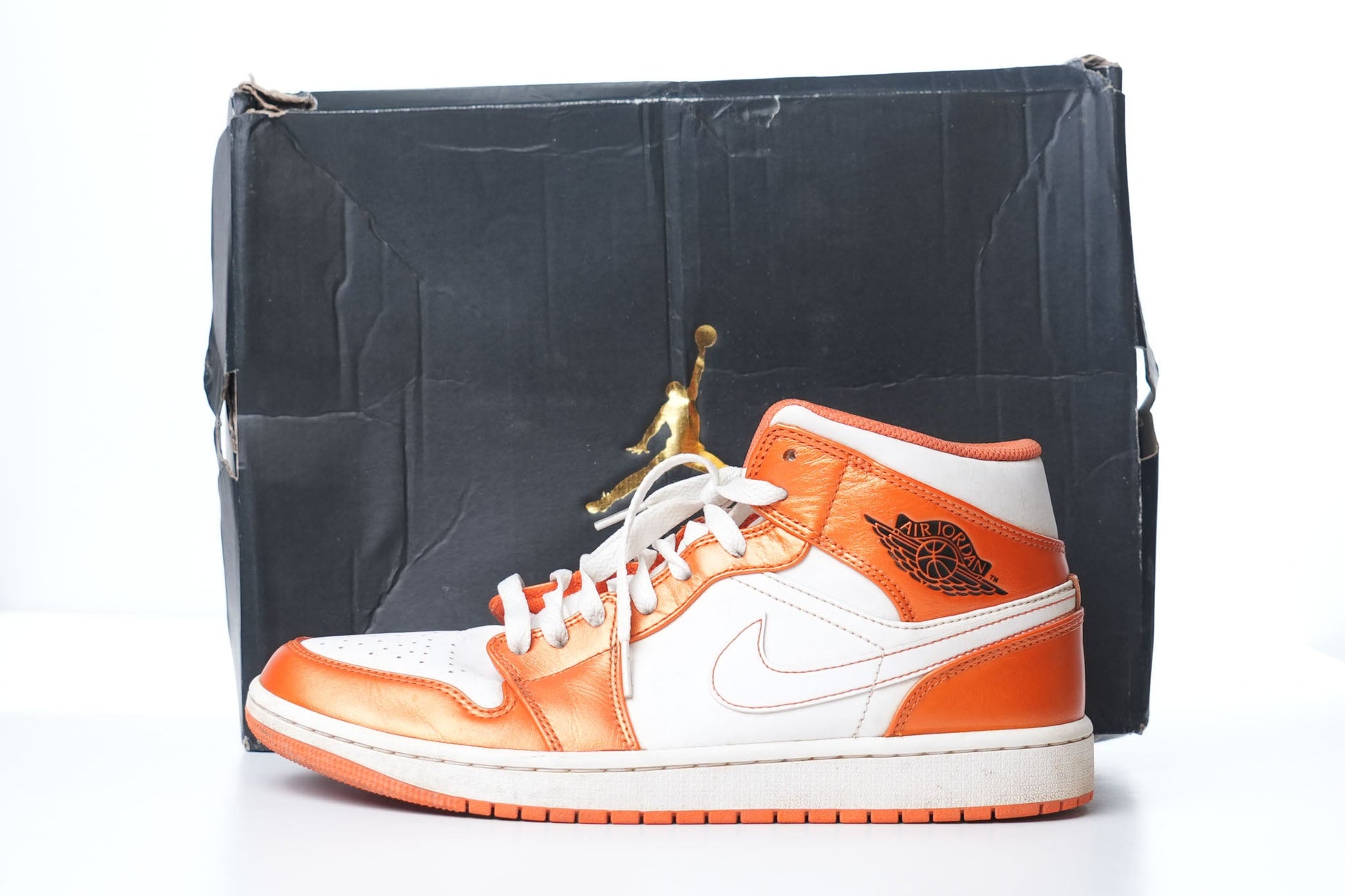 Nike Air Jordan 1 Mid SE Metallic Electro Orange And White Sneakers