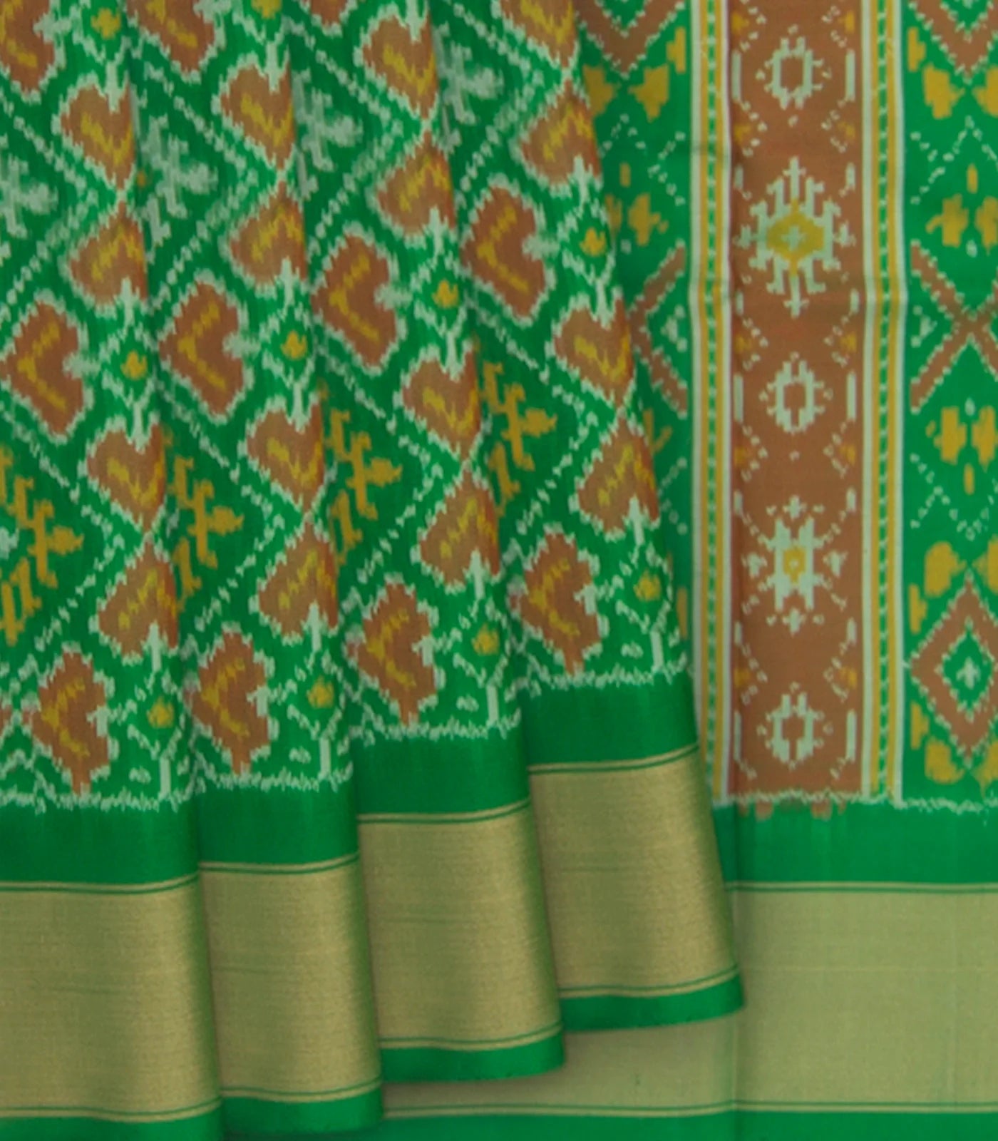 Green Handwoven Rajkot Patola Silk Saree With Diamond Motifs And Golden Zari Border-Green