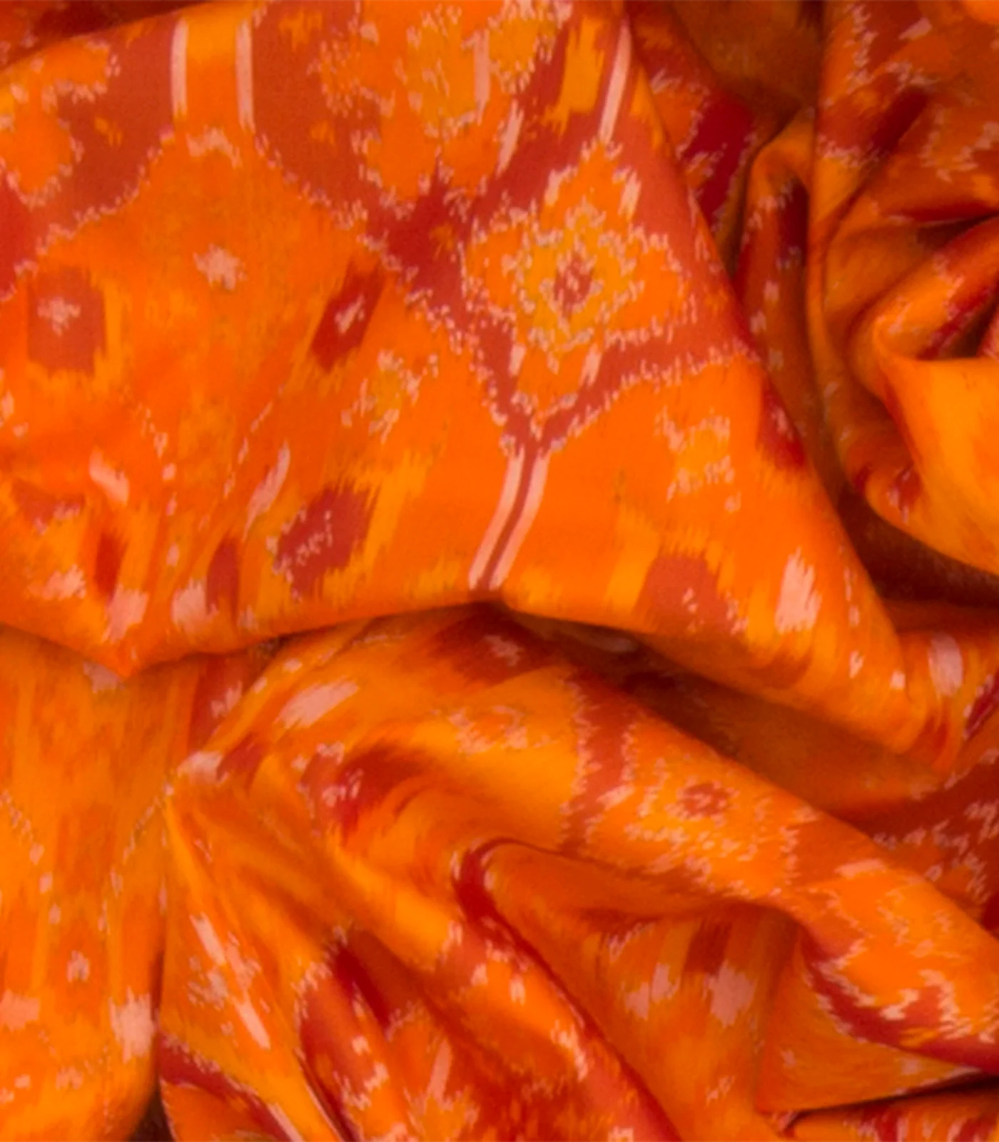 Orange Handwoven Rajkot Patola Silk Saree With Parrot and Elephant Motifs On Pallu