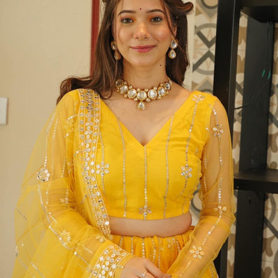 Aisha yellow net lehenga choli set