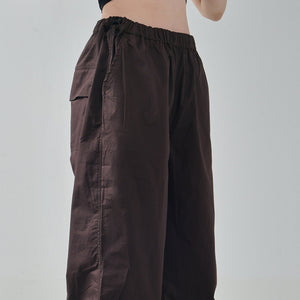 Black Ruffle Top & Brown Parachute Pants