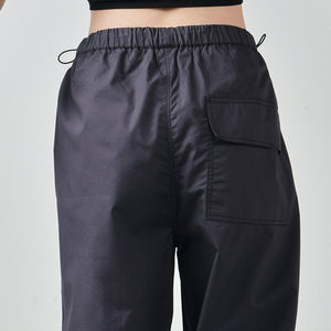 Black Ruffle Top & Gunmetal Parachute Pants