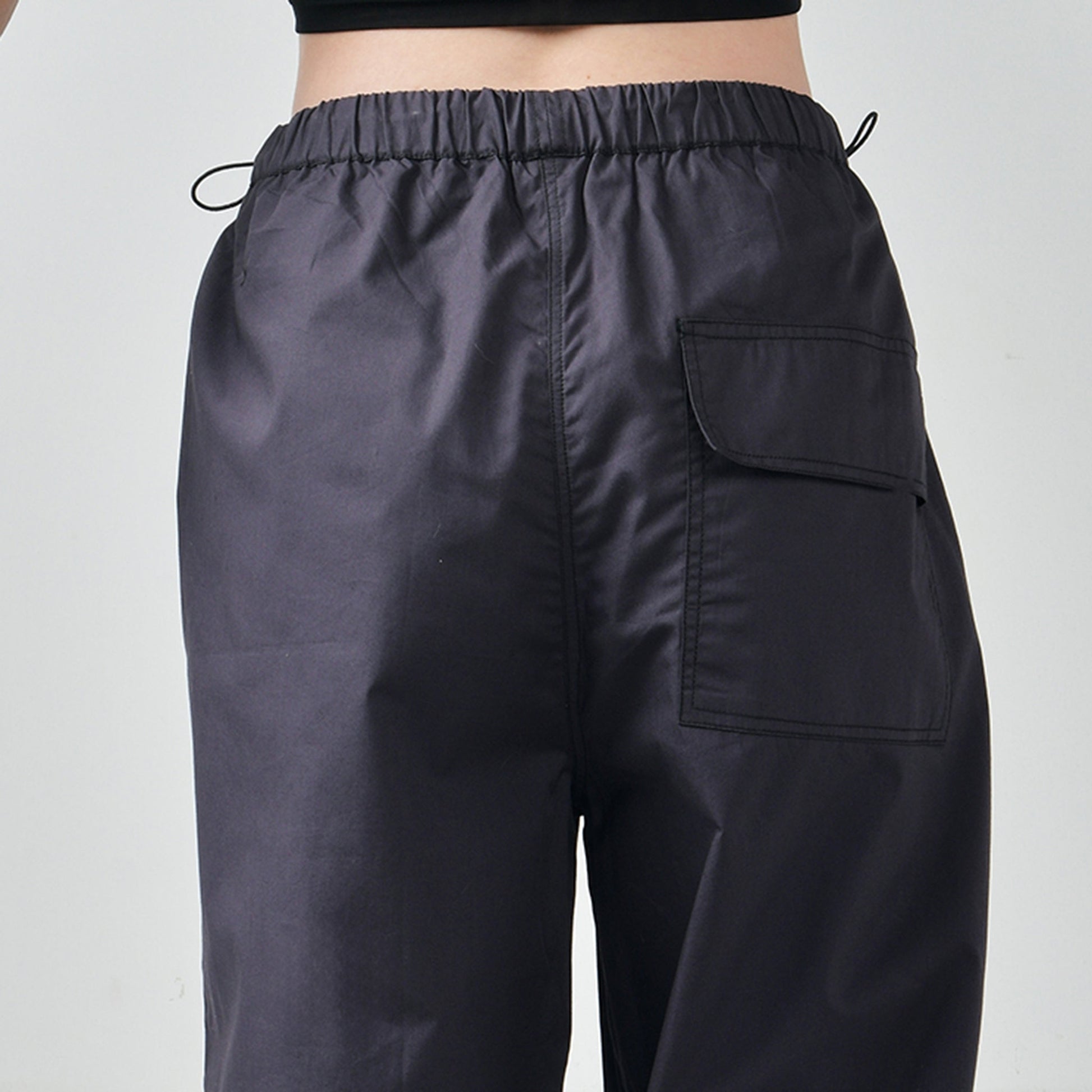 Black Ruffle Top & Gunmetal Parachute Pants
