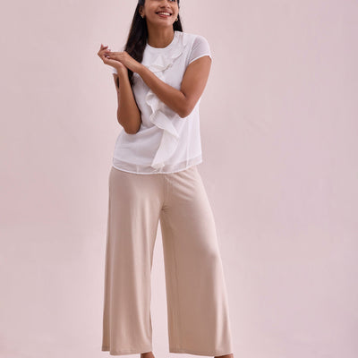 Women Solid Light Beige Viscose Mid Rise Knit Palazzos