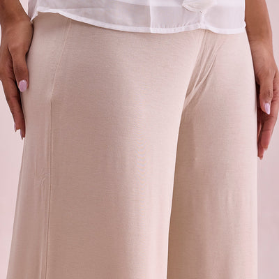 Women Solid Light Beige Viscose Mid Rise Knit Palazzos