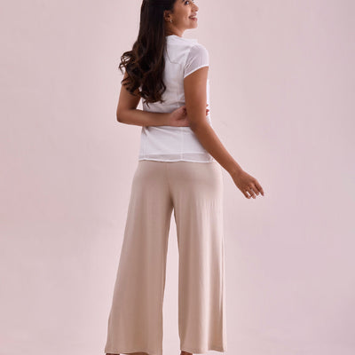 Women Solid Light Beige Viscose Mid Rise Knit Palazzos