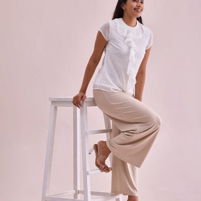 Women Solid Light Beige Viscose Mid Rise Knit Palazzos