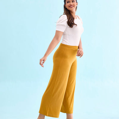 Women Solid Mustard Viscose Mid Rise Knit Palazzos