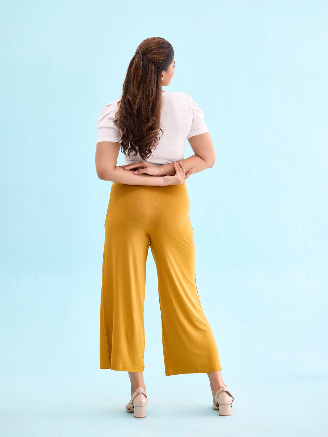 Women Solid Mustard Viscose Mid Rise Knit Palazzos