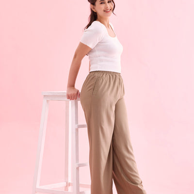 Women Beige Solid Viscose Knit Mid Rise Palazzos