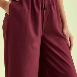 Women Maroon Solid Viscose Knit Mid Rise Palazzos