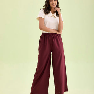 Women Maroon Solid Viscose Knit Mid Rise Palazzos