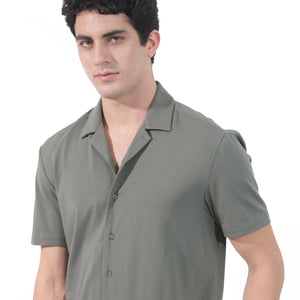 Rare Rabbit Men's Nick Dark Green Cotton Lycra Fabric Cuban Collar Half Sleeves Solid Shirt
