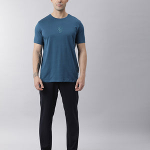 Rare Rabbit Men's Oval Petrol Cotton Fabric Crew Neck Half Sleeves Slim Fit Logo Detailing Solid T-Shirt