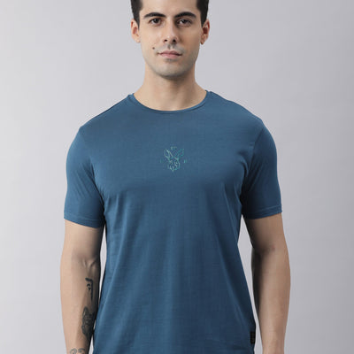 Rare Rabbit Men's Oval Petrol Cotton Fabric Crew Neck Half Sleeves Slim Fit Logo Detailing Solid T-Shirt